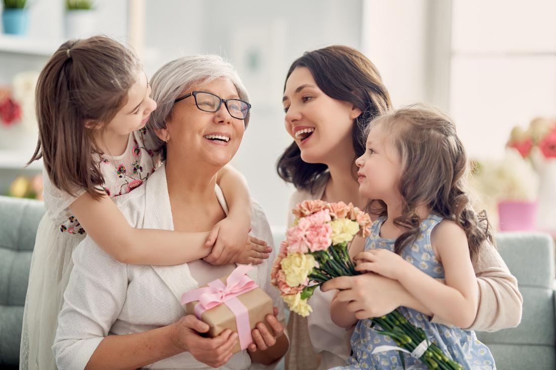 Grandmother, Mother and 2 daughters all smiling