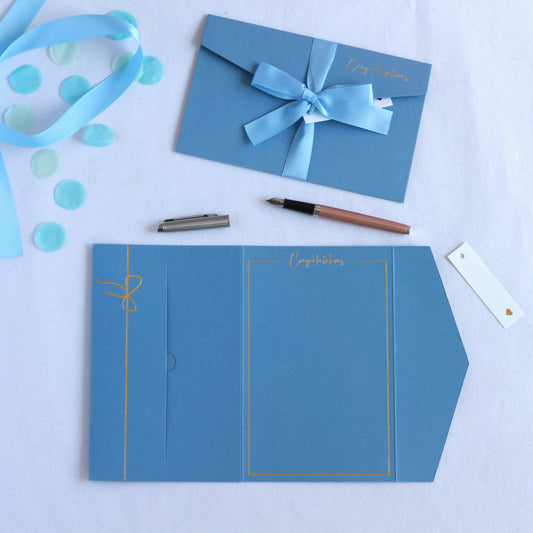 Blue pocket congratulations greeting card with ribbon and tag