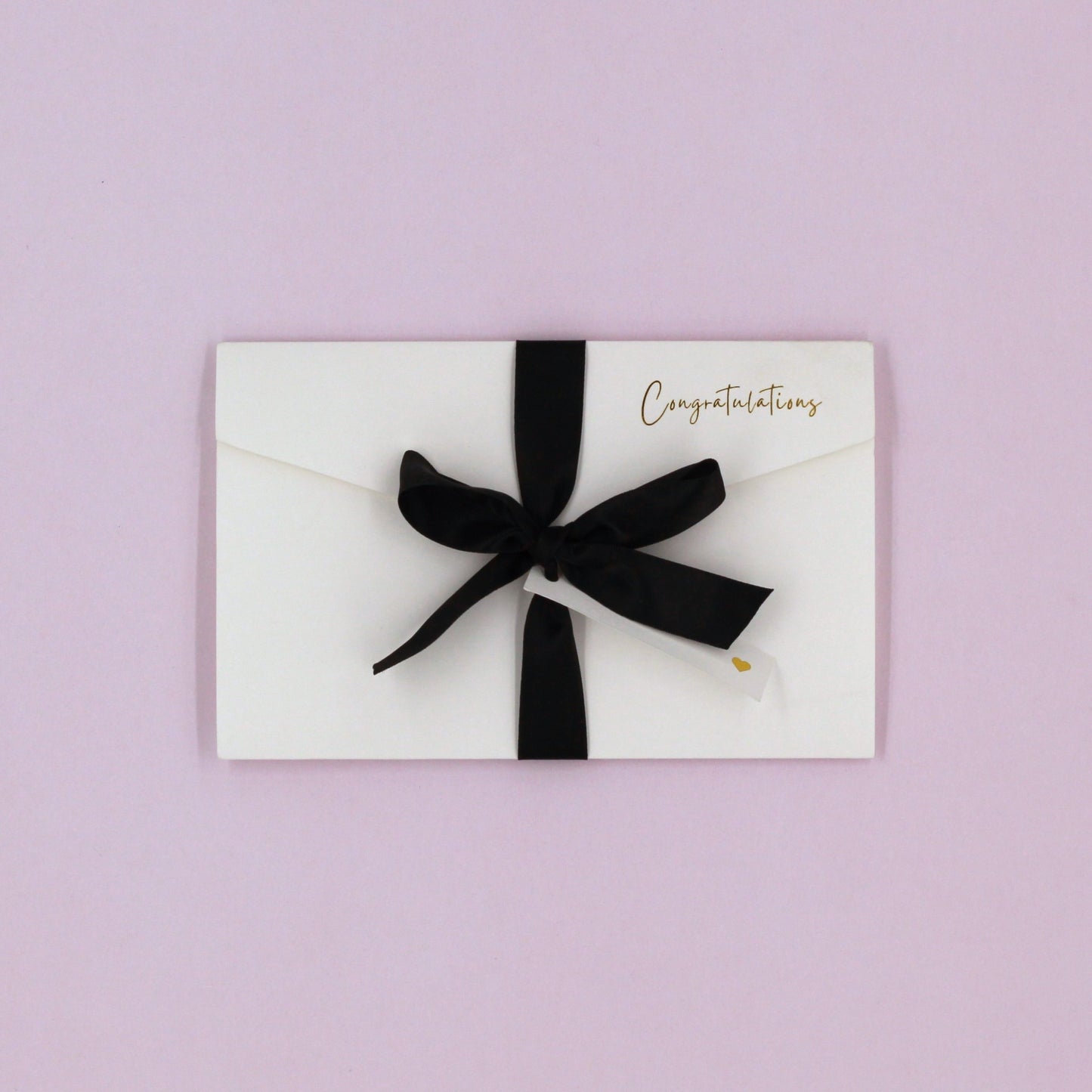 White congratulations pocket greeting card with black ribbon and white name tag