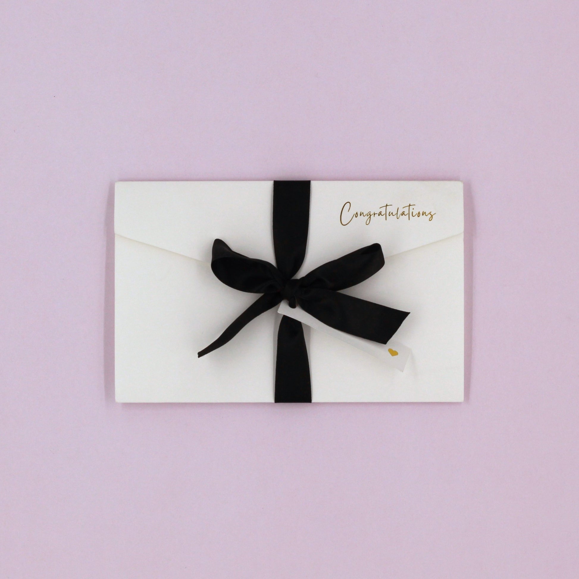 White congratulations pocket greeting card with black ribbon and white name tag