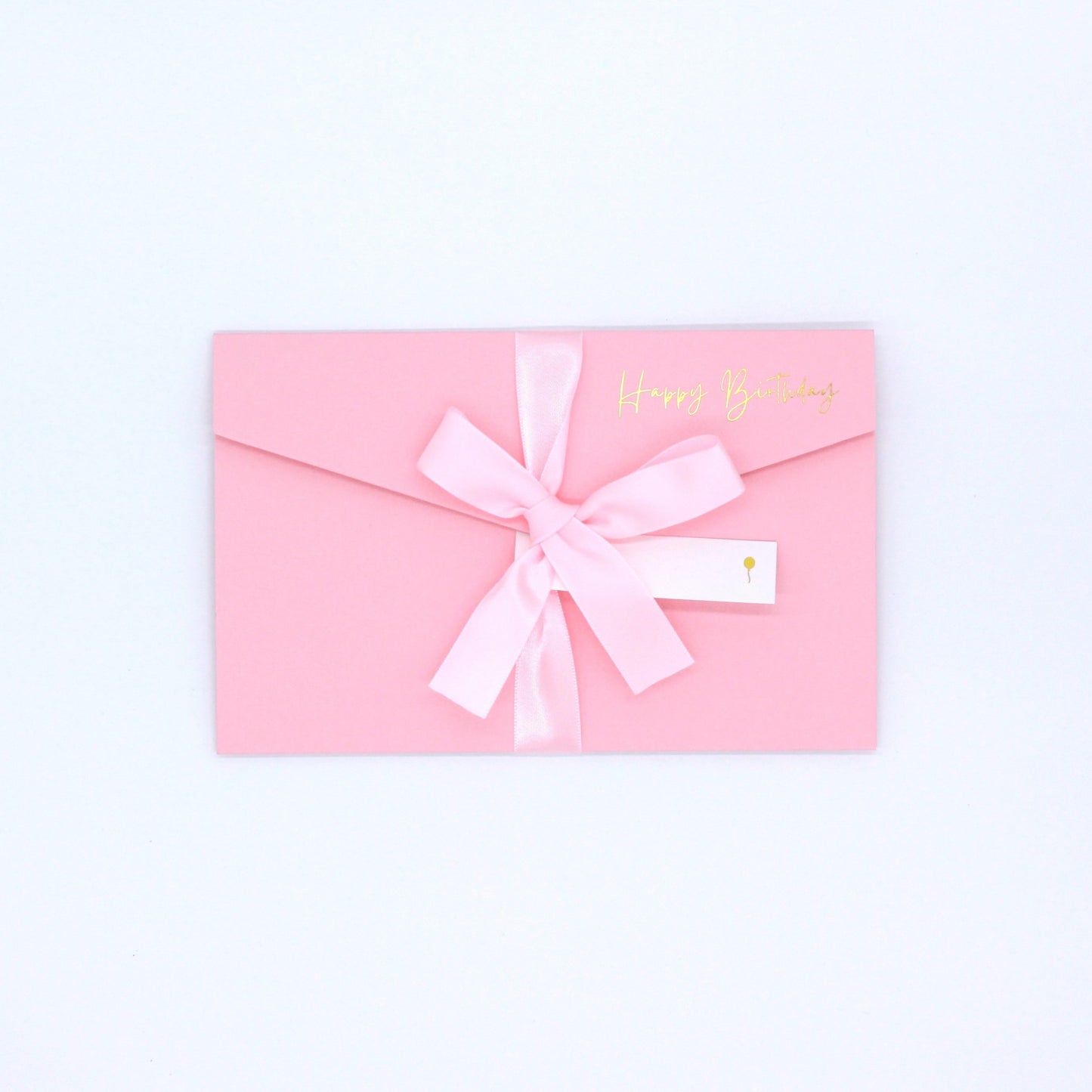 Pink pocket birthday greeting card with pink ribbon and white name tag